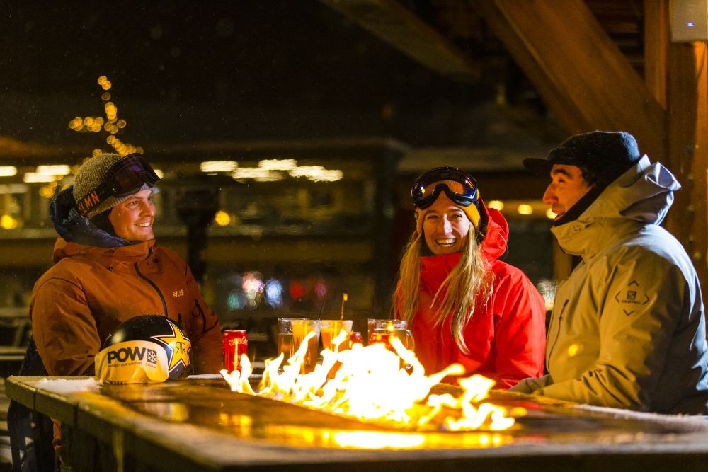 Skiers around a fire